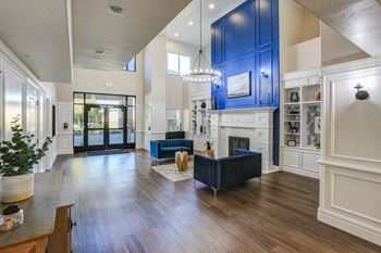 Spacious entryway with bold blue accent wall